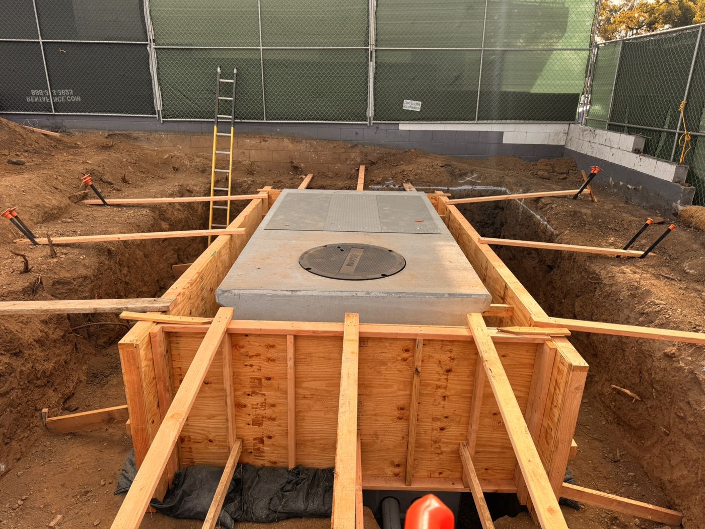 Formed SCE vault in an open excavation inside a fenced site